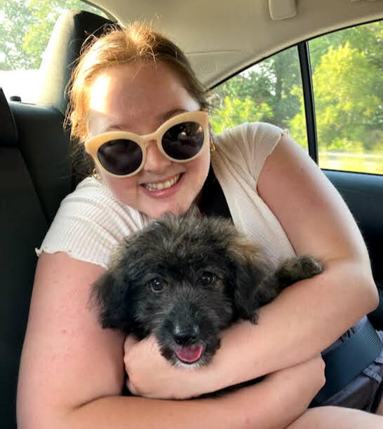 Headshot of Ashley, she is smiling at the camera.