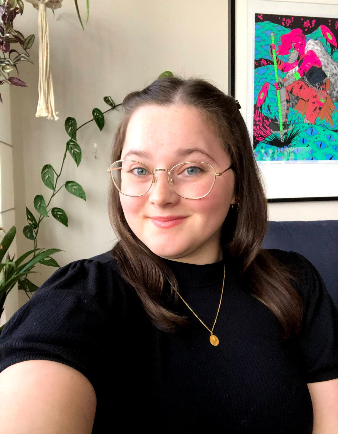 Headshot of Ashley, she is smiling at the camera.